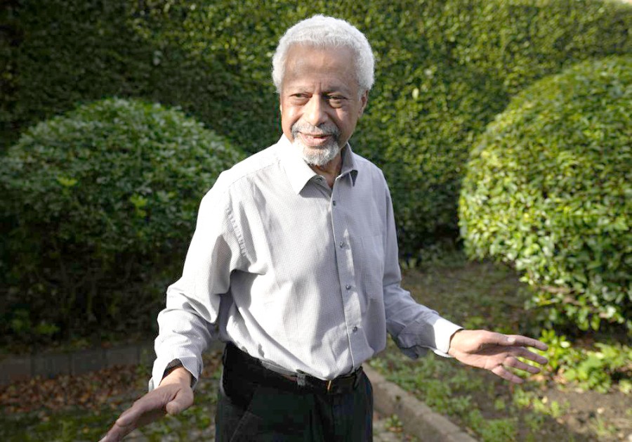 Tanzanian writer Abdulrazak Gurnah gestures as he poses for a photo at his home in Canterbury, England, Thursday, Oct. 7, 2021. Gurnah was awarded the Nobel Prize for Literature earlier on Thursday. The Swedish Academy said the award was in recognition of his "uncompromising and compassionate penetration of the effects of colonialism." (AP Photo)